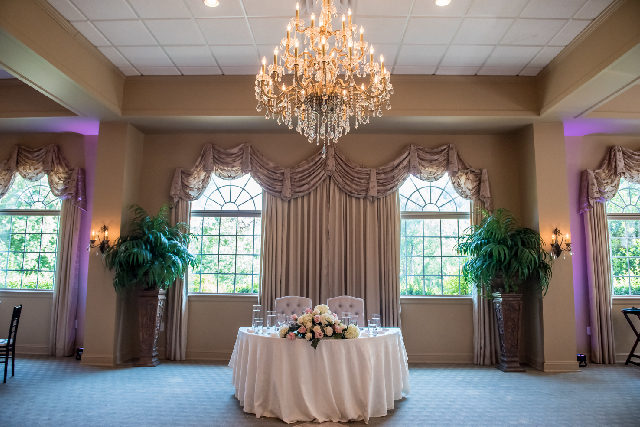 A grand ballroom prepared for a gala after an event success energy cleansing session.
