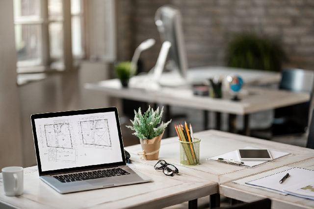 A laptop displaying a floor plan during a virtual space cleansing for homes and offices.